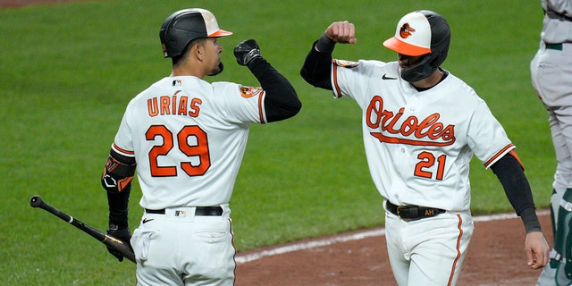 Austin Hays of the Orioles celebrates with Ramon Urias after hitting a home run against the Oakland Athletics at Camden Yards on April 10, 2023, in Baltimore.