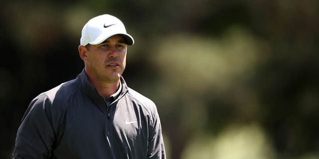 Brooks Koepka walks on the first hole during the final round of the 2023 Masters Tournament at Augusta National Golf Club in Augusta, Georgia, on Sunday.