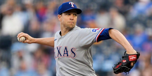 Texas Rangers starting pitcher Jacob deGrom throws to a Kansas City Royals batter during the first inning of a baseball game, Monday, April 17, 2023, in Kansas City, Mo.