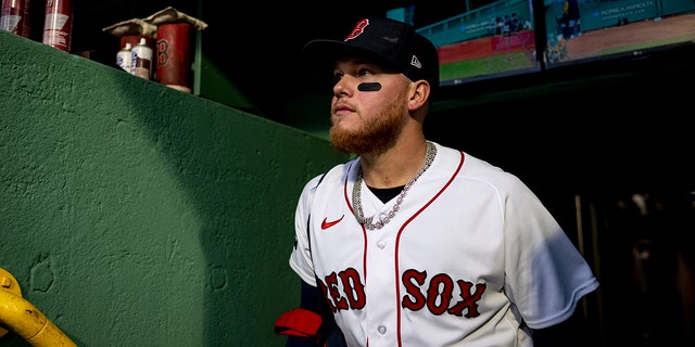 Alex Verdugo #99 of the Boston Red Sox walks into the dugout before a game against the Pittsburgh Pirates on April 4, 2023 at Fenway Park in Boston, Massachusetts.