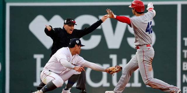 Los Angeles Angels designated hitter Shohei Ohtani gestures safe after advancing to second against the Red Sox at Fenway Park, Saturday, April 15, 2023, in Boston.