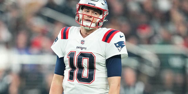 Quarterback Mac Jones of the New England Patriots reacts after a play during the second half of a game against the Las Vegas Raiders at Allegiant Stadium Dec. 18, 2022, in Las Vegas. 