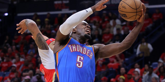 Luguentz Dort #5 of the Oklahoma City Thunder shoots against Brandon Ingram #14 of the New Orleans Pelicans during the first half at the Smoothie King Center on April 12, 2023, in New Orleans, Louisiana. 