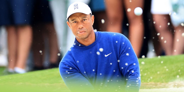 Tiger Woods plays his third shot on the 17th hole during a practice round prior to the 2023 Masters Tournament at Augusta National Golf Club on April 3, 2023 in Augusta, Georgia.