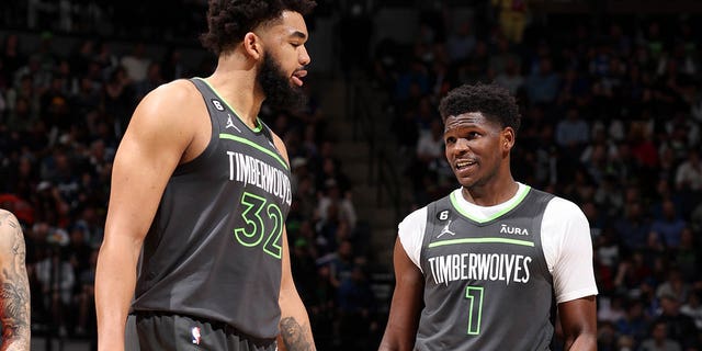 Karl-Anthony Towns #32 of the Minnesota Timberwolves talks with Anthony Edwards #1 of the Minnesota Timberwolves during the game against the Oklahoma City Thunder during the 2023 Play-In Tournament on April 14, 2023, at Target Center in Minneapolis, Minnesota.E 