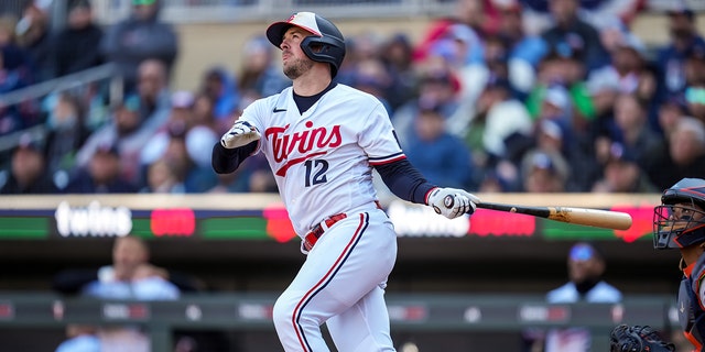 Kyle Farmer of the Minnesota Twins bats against the Houston Astros April 7, 2023, at Target Field in Minneapolis. 