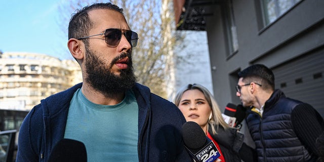 Influencer Andrew Tate arrives at the Directorate for the Investigation of Organized Crime and Terrorism to attend a hearing on April 10, 2023.