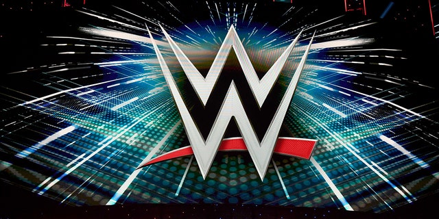 A WWE logo is shown on a screen before a news conference at T-Mobile Arena on Oct. 11, 2019, in Las Vegas.