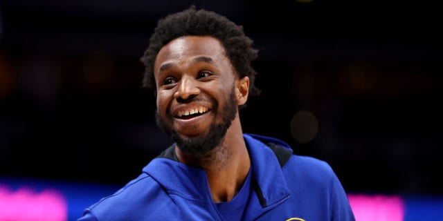 Andrew Wiggins of the Golden State Warriors warms up against the Denver Nuggets at Ball Arena March 10, 2022, in Denver, Colo. 