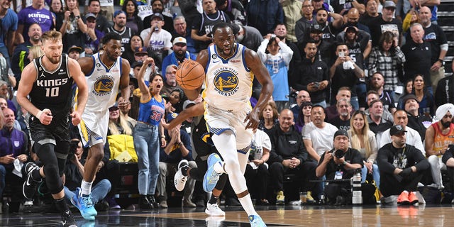 Draymond Green #23 of the Golden State Warriors moves the ball during Round 1 Game 2 of the 2023 NBA Playoffs on April 17 2023 at Golden 1 Center in Sacramento, California.