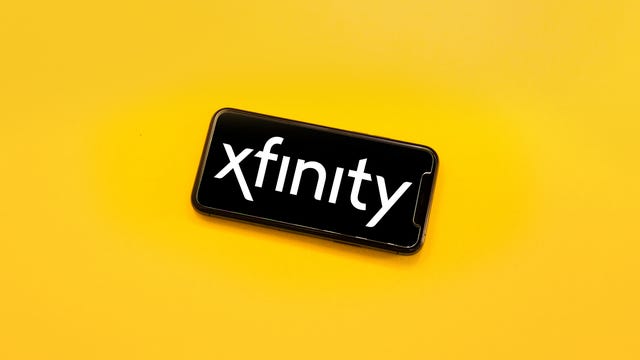 A phone displays the Xfinity Logo