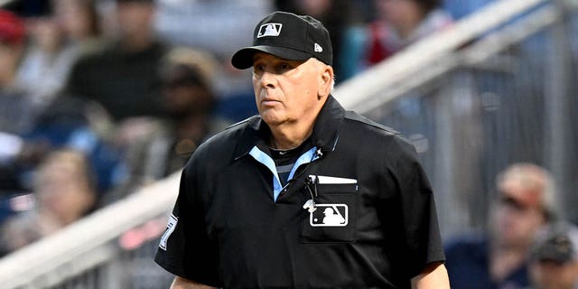 Home plate umpire Larry Vanover calls the game between the Washington Nationals and the Tampa Bay Rays at Nationals Park on April 03, 2023 in Washington, DC.